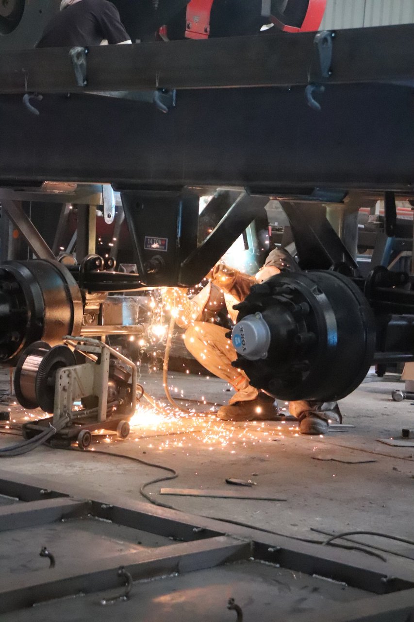 GoldLine Factory welding sparks under trailer chassis