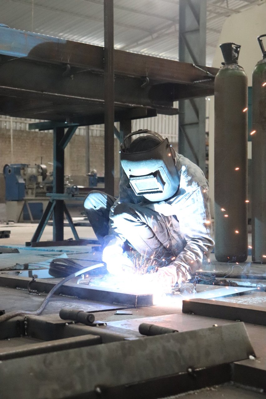 GoldLine Automobiles factory welder at work
